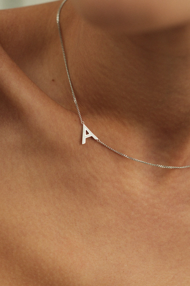 LETTER A NECKLACE WITH WHITE ENAMEL title=